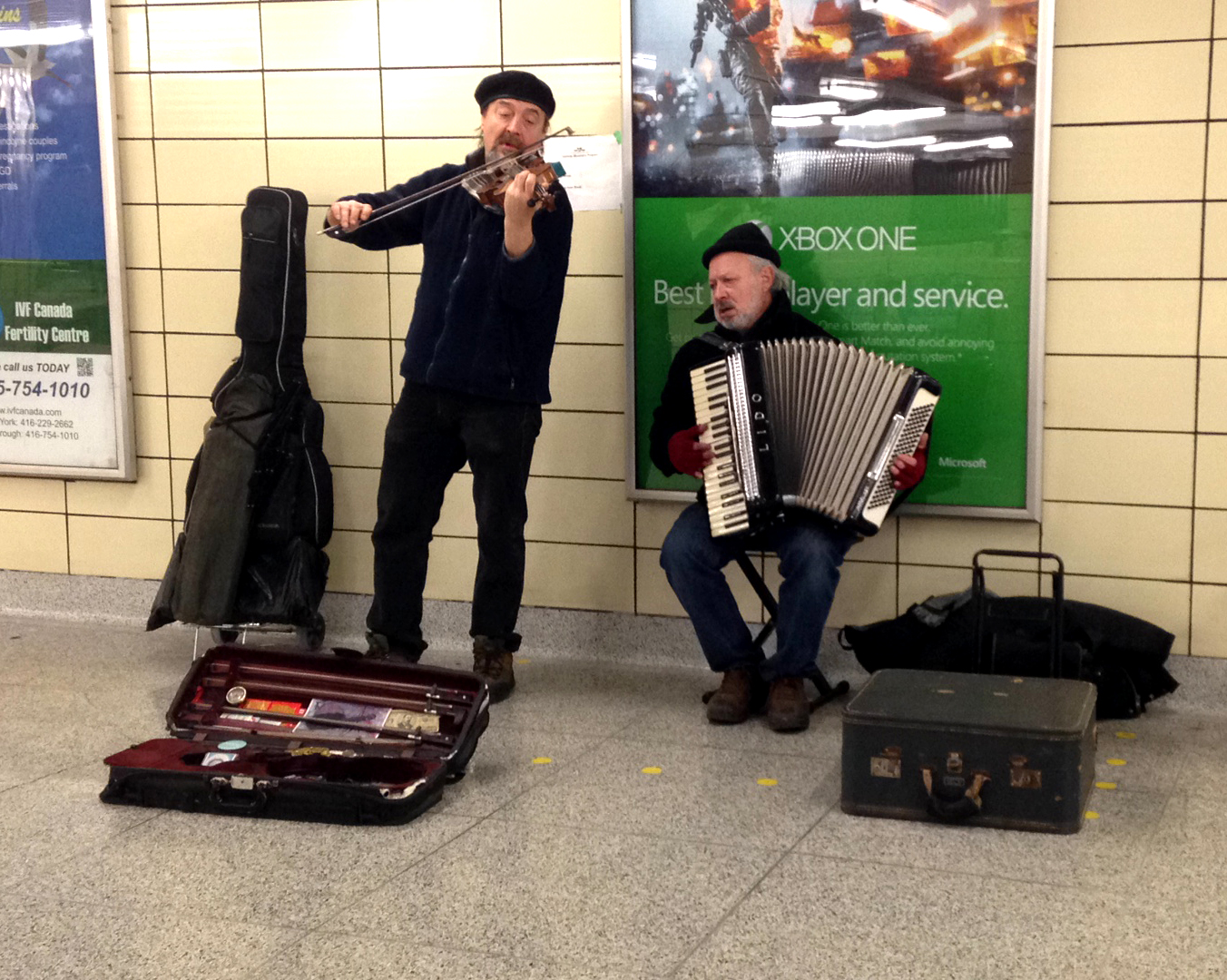 Andrei and Andre playing Violin and Accordian in the subway station