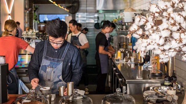 international students working in a coffee shop in Sydney Australia. Work in Australia.