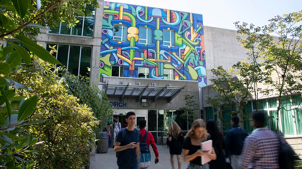 Capilano University, students walking outside from one of the campus entrances