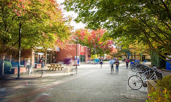 Students walking around the Camosun College Lansdowne campus in Victoria, British Columbia.