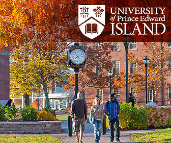 Three students walking outside on a fall day at the campus of the University of Prince Edward Island in Canada.